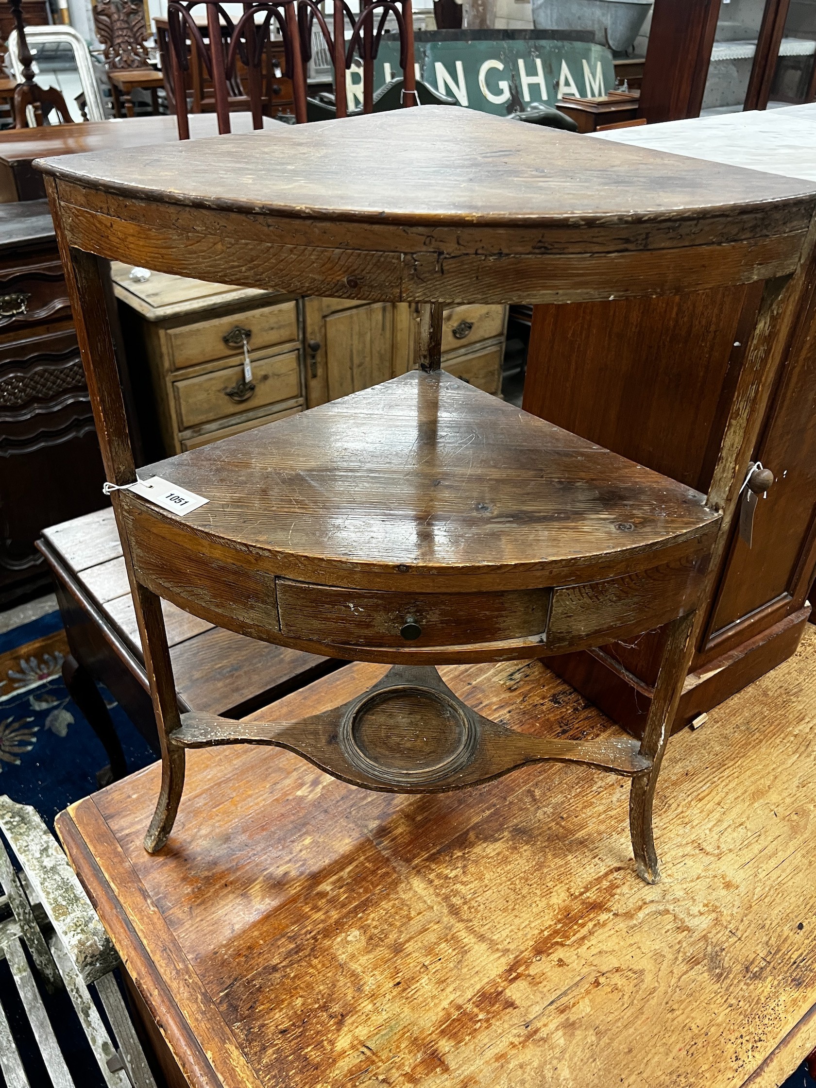 A George III pine bowfront three tier corner washstand, width 60cm depth 40cm height 80cm